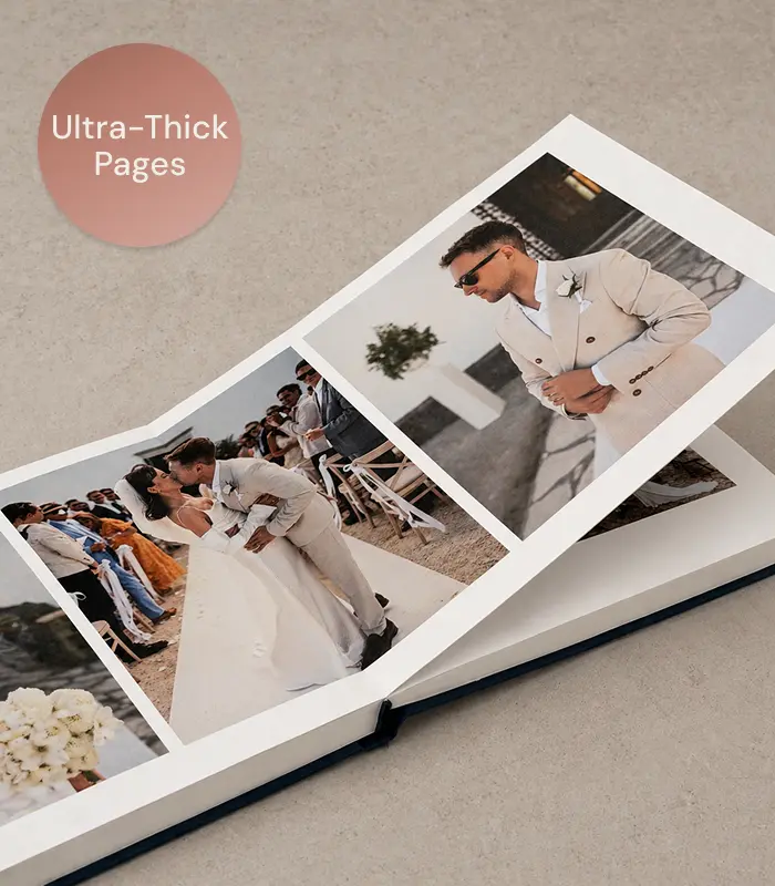 A close-up of a wedding album's lay-flat binding with a photograph running uninterrupted across the spread.